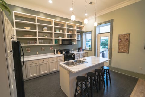 Kitchen is stocked with an assortment of pots and pans if you want to eat-in