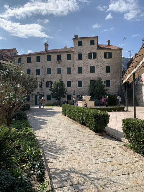 The front of the house with a park with a good fish restaurant and shops.