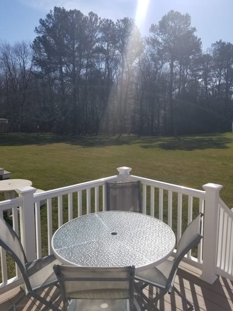Deck view of (and access to) green space and woods. Deck access via living room.