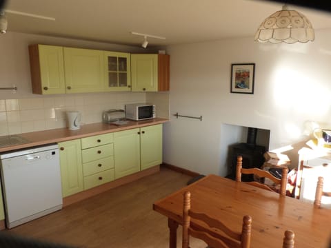 Well equipped kitchen with log burner