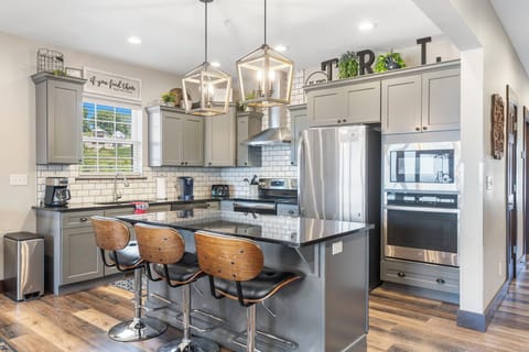 Spacious kitchen with extra seating at the island. Just bring the food!