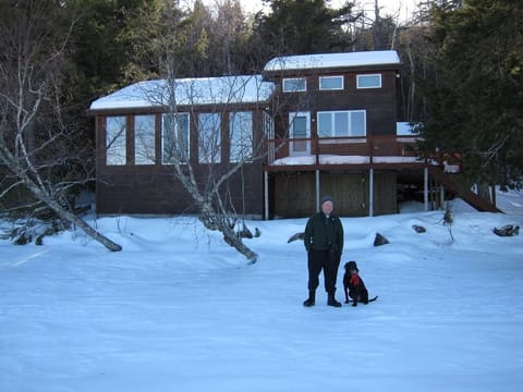 Guests in front of house in winter