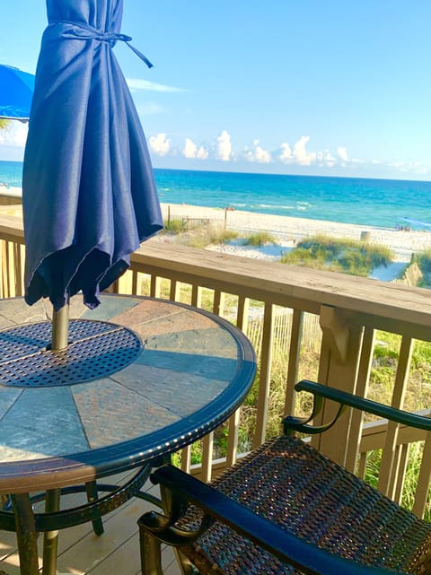 Back deck table w/ umbrella,Grill . 8 chairs &3 lounge chairs.