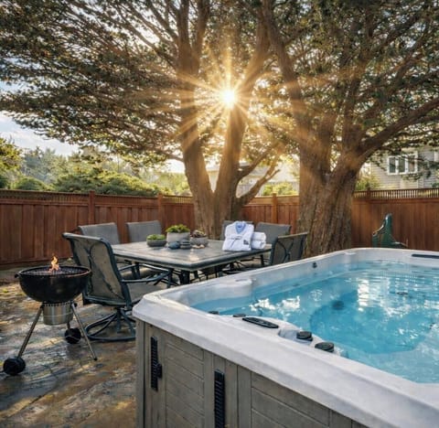 Enjoy the hot tub amongst the cypress trees after a day at the beach