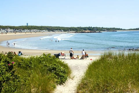 Just steps to this white sandy beach!
