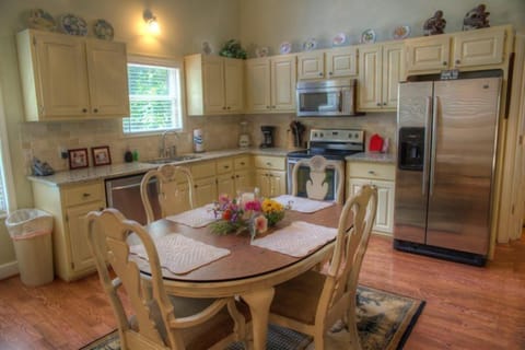 Fully equipped kitchen with stainless steel appliances and granite counter tops.