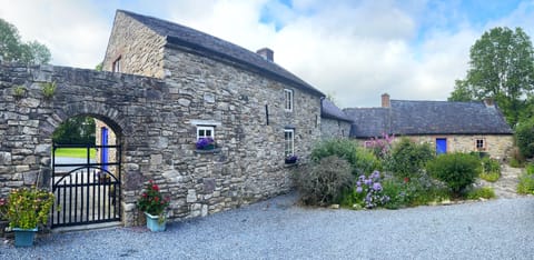 Courtyard, showing gate to Guest Cottage. The Main Cottage is in the background.