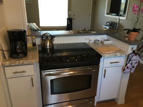 Stove with full cooking and amenities.