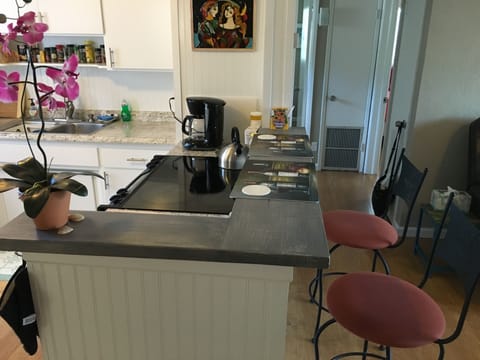 Kitchen with side eating area.