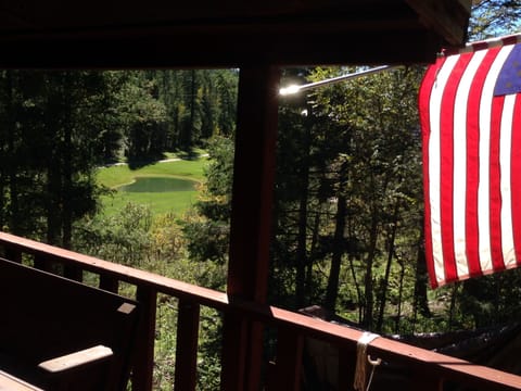 View of 7th hole Fairway, pond, woods from covered breezeway