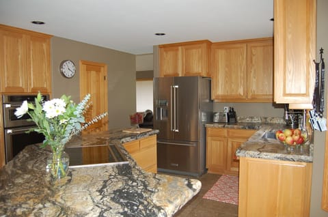 Kitchen with brand new appliances and solid granite slab