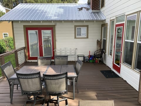 Backyard deck off master bedroom and enclosed porch.