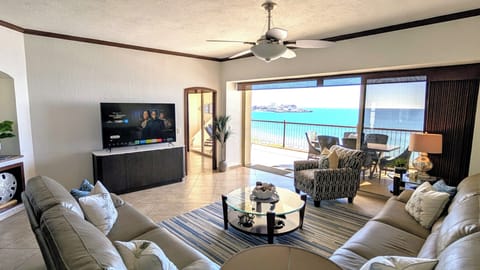 Living Area, large covered patio equipped with ceiling fans & plenty of seating!