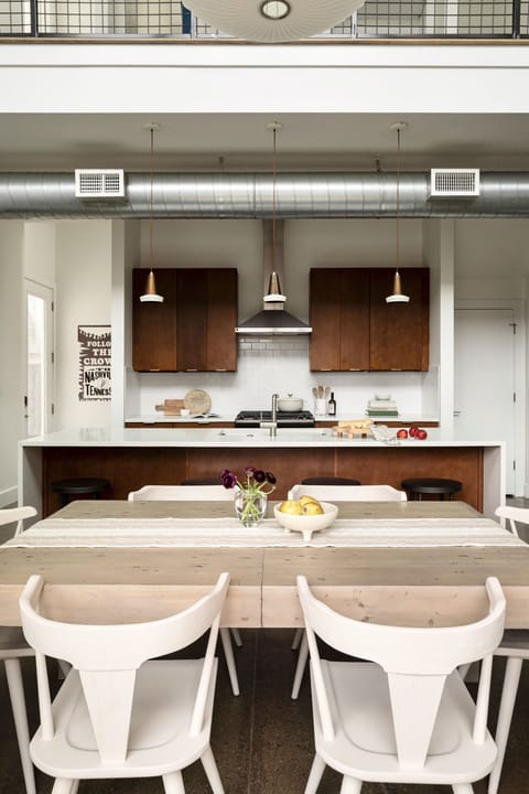 view from first floor patio into kitchen and dining area