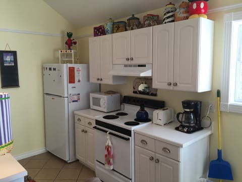 Kitchen stove, refrigerator, microwave, toaster and coffee pot