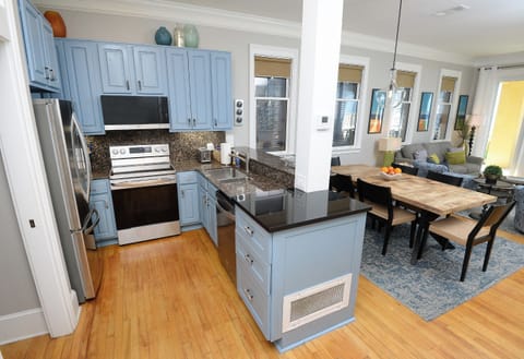 Fully equipped kitchen with granite countertops and stainless steel appliances.