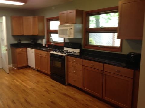 Kitchen with dishwasher and granite countertops.