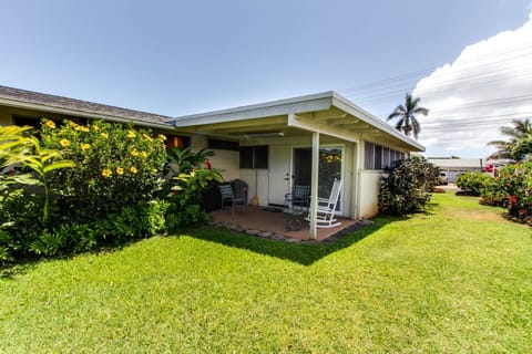 Tropical flowers embrace the peaceful lanai off the family room.