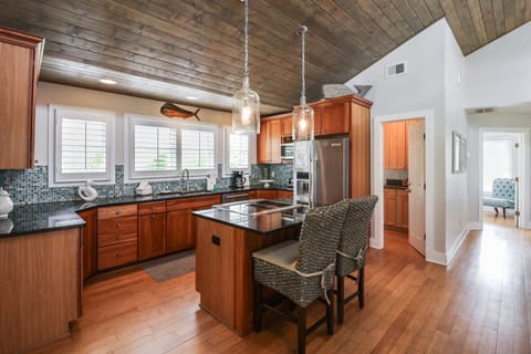 Large kitchen on the 3rd floor with extra seating at the bar