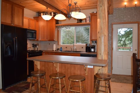 Seating for 4 more on the island. 
Light efficient kitchen.
