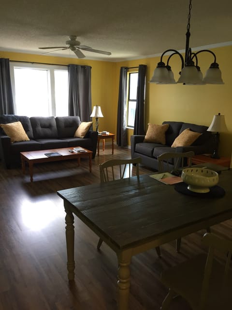 View into Dining/Living Area (50 inch TV is on wall to left)