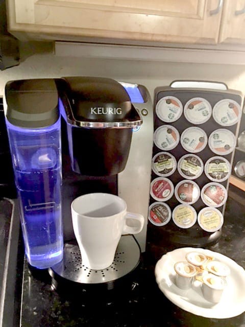Keurig coffee and tea maker and assortment of coffees
teas and flavored creamer