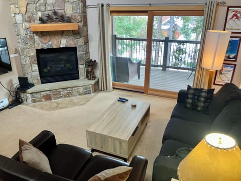 Living Room Featuring Gas Fireplace and Flat Screen TV. Access to covered deck.