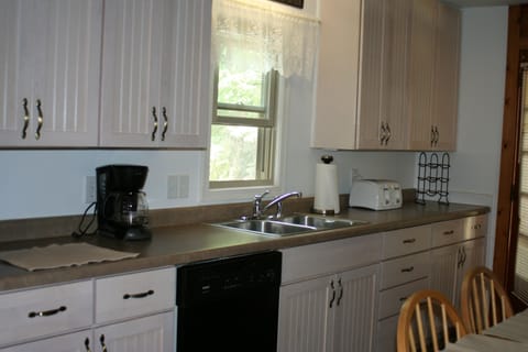 Kitchen with Coffee Maker, Dishwasher, toaster, microwave.