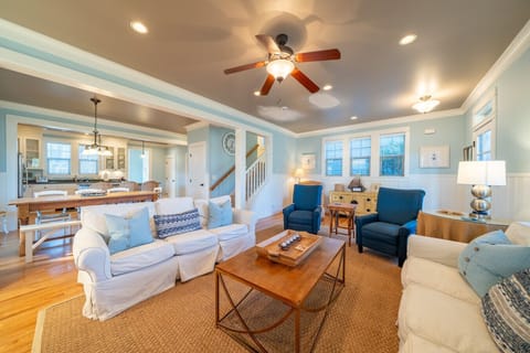 The heart of Beach Haven. This open-concept living area flows seamlessly into the kitchen, ensuring nobody is left out of the conversation.