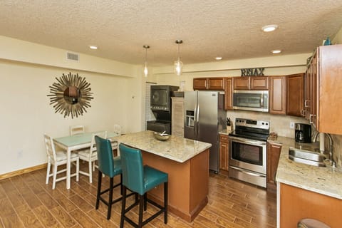 Gourmet Kitchen with Large Island, Granite Countertops and Stainless Appliances