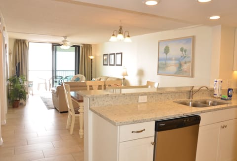 Living area is bright and open and sliders open to take in the sound of the gulf