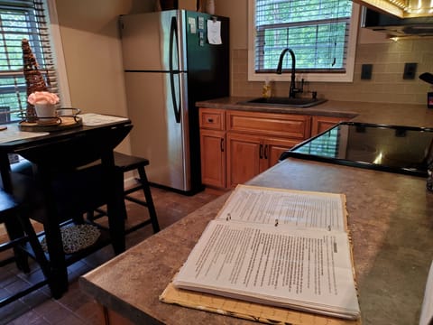 Docs Lakeside Cabin information book kept on the kitchen counter