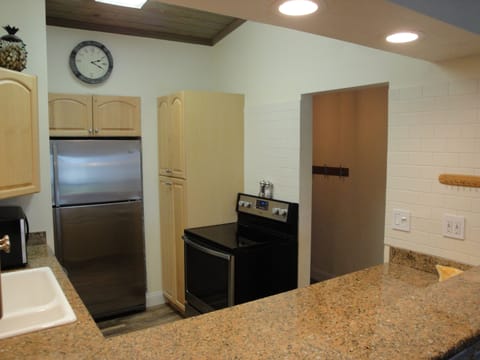 Kitchen and Hallway (stainless steel refrigerator and stove/convection oven)