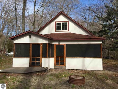 Back porch, grilling deck (charcoal grill included), and fire ring.  Loft above.