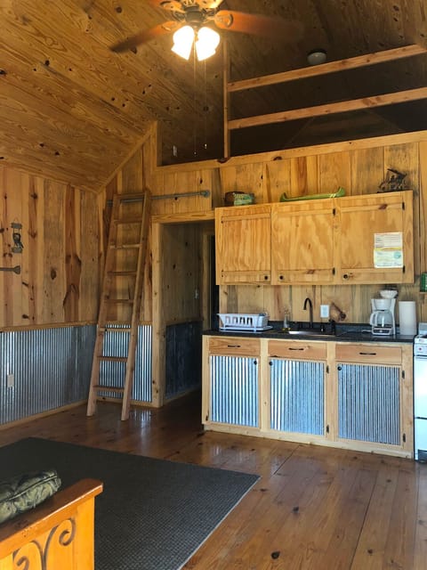 Kitchen area - stocked with pots, pans, dishes, utensils, etc.
