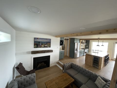 Sunken living room with 55” Smart TV and fireplace 