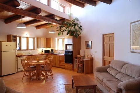 Fully equipped kitchen and dining area, opens into living room, big bright space