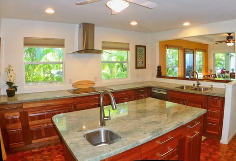 True chef's kitchen with 36" cooktop, double oven, and two sinks.