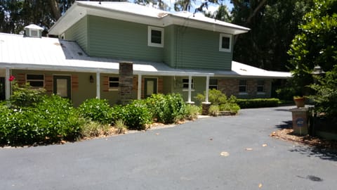 back of the house... paved drive is gated on the 132nd place side.