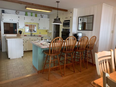 Kitchen with breakfast bar and chairs