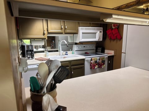 Looking into kitchen thru the opening.