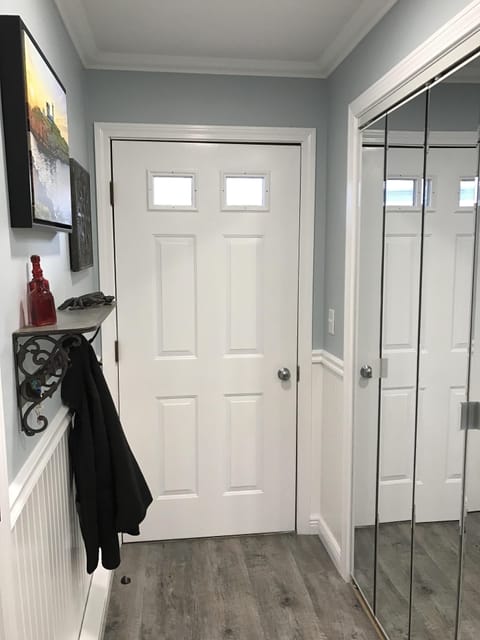 Bright and cheery entryway with closet
