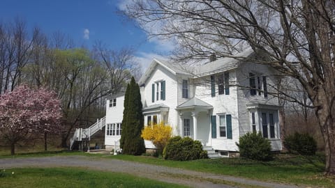 House in springtime - Apt. stairs on the left towards the back of the house 