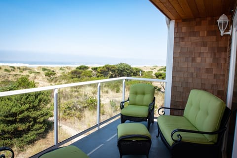 Upper deck with 2 cozy chairs w/ottomans & loveseat, and charcoal grill