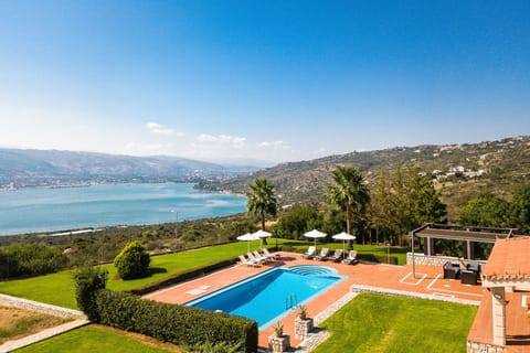 The pool terrace is equipped with sun beds and umbrellas