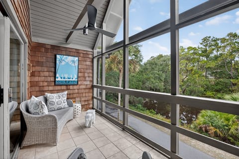 Island mornings start here—your screened porch retreat at Mariners Watch Villa.