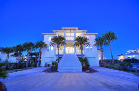 Elegant evening view of the entry, softly lit for a welcoming arrival