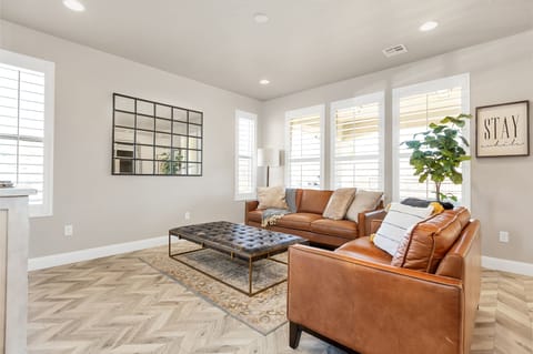 Professionally decorated family room featuring comfortable seating