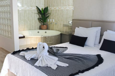 Deluxe Double Room | Minibar, desk, blackout drapes, iron/ironing board