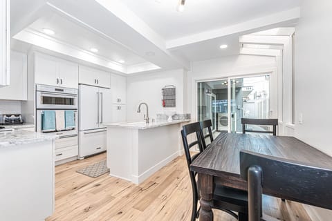 The kitchen opens out to the dining area, making meal prep a social affair!